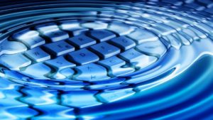 keyboard underneath rippling water