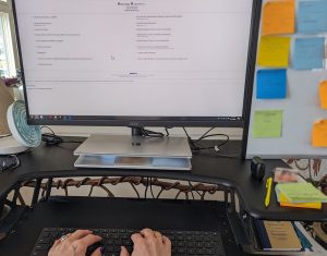 berkshire hathaway website on screen of computer on a desk