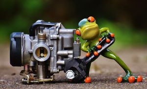 frog mechanic working on an engine